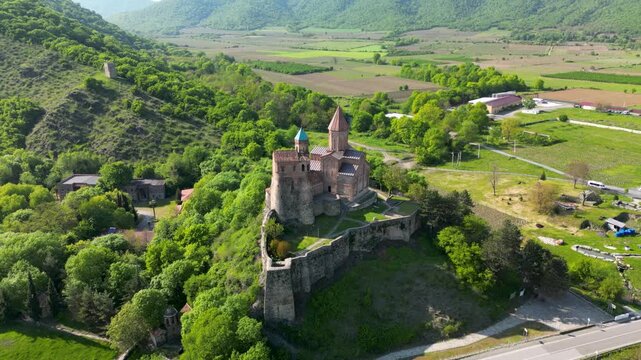 Aerial view of Gremi Monastery, a historic architectural complex in the Kakheti region, with surrounding landscape.