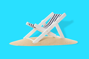 Fototapeta premium Striped beach chair stands on sandy surface with bright color