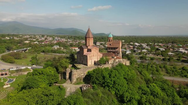 Aerial view of Gremi Monastery, a historic architectural complex in the Kakheti region, with surrounding landscape.