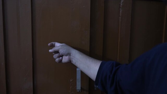 Raw 4K footage of a hand knocking on a wooden door, showing everyday action, communication gesture, and simple lifestyle moment in an indoor setting.