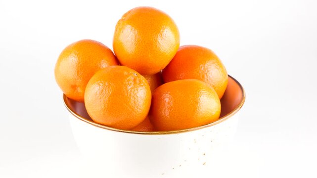 white plate filled with ripe juicy tangerines