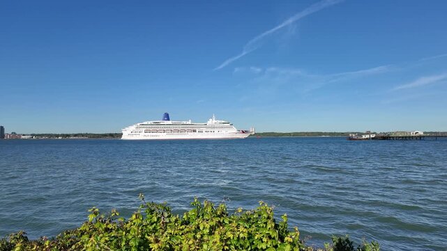 Southampton England UK. 28.04.2026. Video. Cruise ship passing Hythe Pier on Southampton Water southern England UK