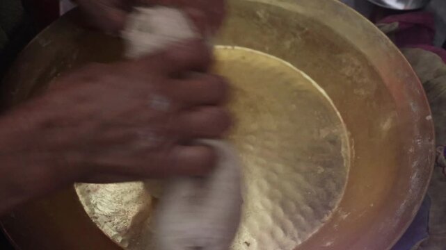 Raw 4K footage of hands kneading dough in a bowl, showing traditional cooking, food preparation, and simple rural lifestyle in an Indian household.