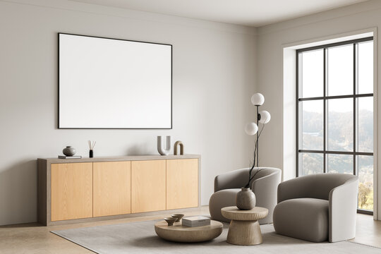 Modern interior living room scene featuring large empty poster mockup on wall within bright minimal architecture space complemented by contemporary furniture and window view. 3D Rendering