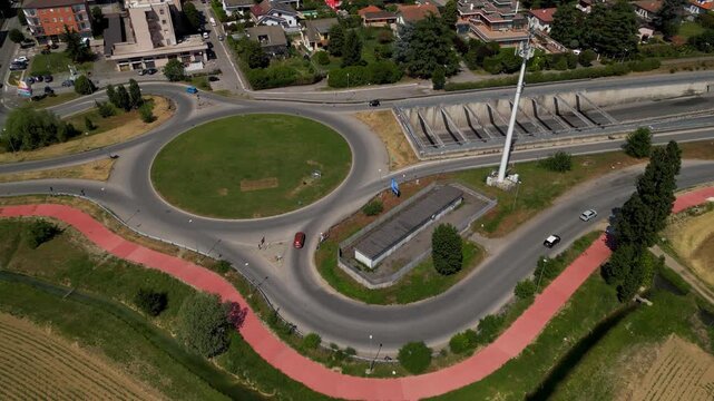 Urban Roundabout Aerial: An eye-level perspective showcases a smoothly designed urban roundabout, seamlessly guiding traffic flow through a city intersection.