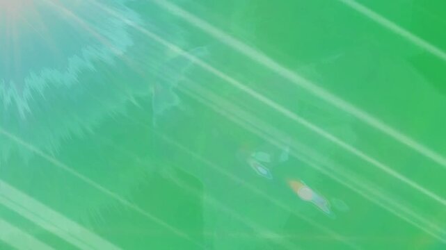Vibrant green abstract background with dynamic diagonal streaks and blue undertones