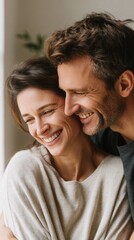 Obraz premium Happy couple embracing, sharing a joyful moment at home.