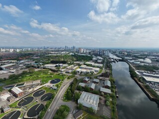 Fototapeta premium Aerial view of Salford Quays and surrounding areas with views towards Manchester skyline in the distance. 