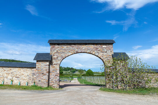 view to historic gate in arch style leading to the vineyards of cloister Eberbach