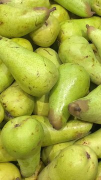 Vegetable market with various fruits and vegetables. Pears and other fruits.