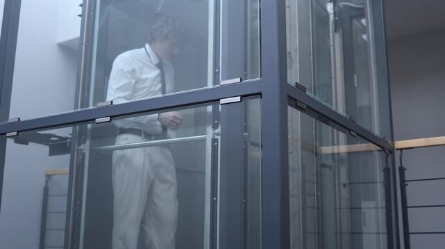 Office worker stands in silence overwhelmed by disappointment after failed deal showing emotional exhaustion stress and quiet frustration from professional setback