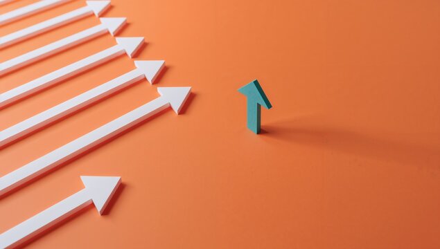 Paper arrows pointing in one direction with a single arrow diverging