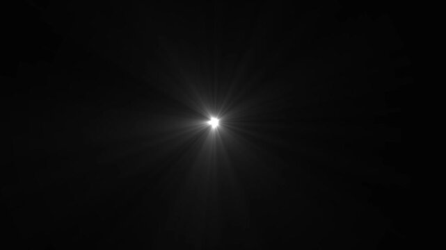 Bright White Starburst Light Effect on Black Background flare glow