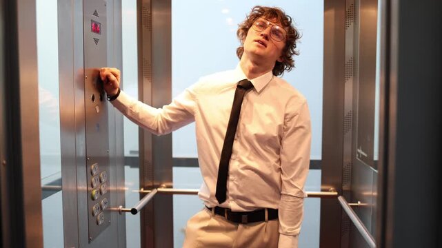 Exhausted office worker leans inside the elevator with a drained expression capturing burnout fatigue emotional overload and the heavy pressure of a long working day