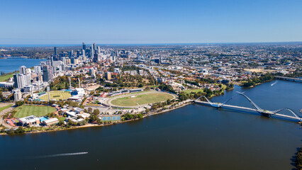 Fototapeta premium Stunning aerial view of Perth's skyline beside the tranquil Swan River on a clear sunny day