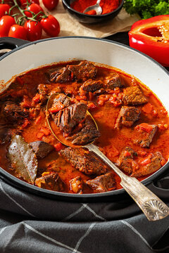 Beef goulash stew with paprika in ceramic pot