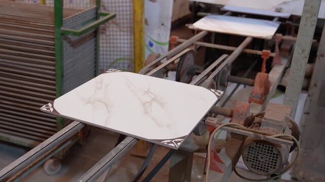 Ceramic tile on conveyor belt in factory close view