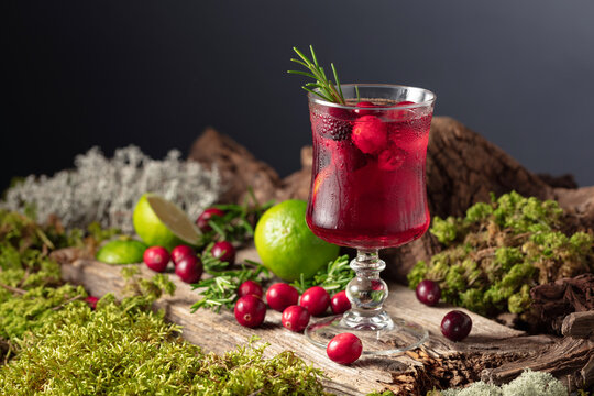 Refreshing cranberry hard seltzer with lime, rosemary, and ice.