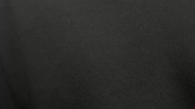 High-quality black wrinkled paper texture animation with stop-motion effect. Features professional studio lighting and minimal shadows for a clean look.