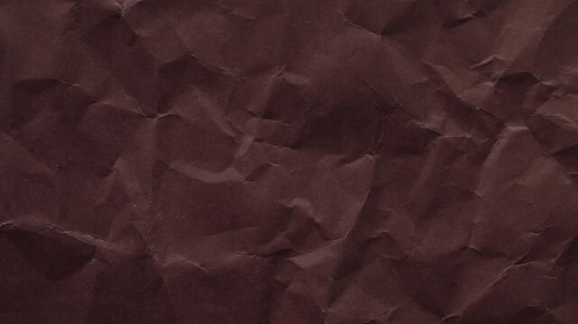 High-quality dark brown wrinkled paper texture animation. Seamless loop with stop-motion effect, perfect for organic and rustic video backgrounds.