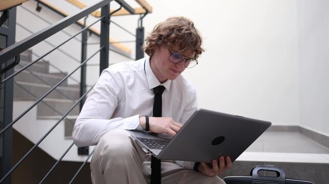 Student preparing for exams studies on laptop reviewing materials focusing on knowledge and concentration during intense learning session before important academic tests