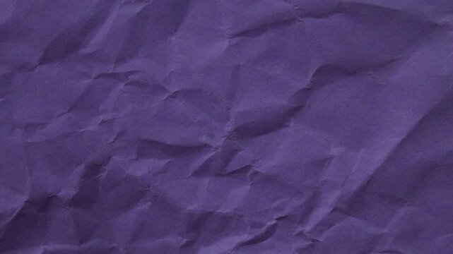 Dark Purple wrinkled paper texture seamless loop. Cool stop-motion animation for creative video overlays and modern backgrounds.