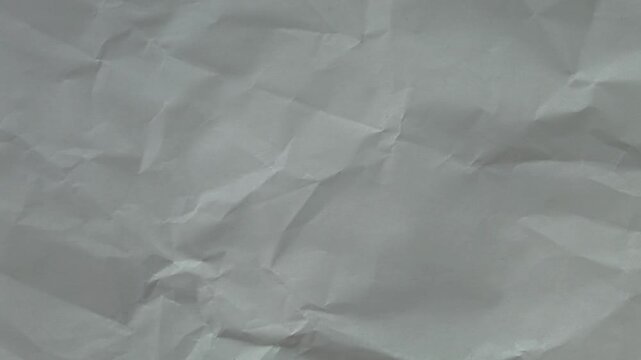 Professional White wrinkled paper texture seamless loop. Minimalist stop-motion animation for neutral video overlays and modern backgrounds.