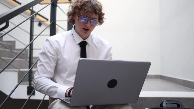 Young ambitious man working hard on laptop staying focused on goals building future and improving skills showing dedication motivation and productivity in modern life