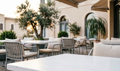Fototapeta premium Outdoor Cafe Terrace with White Tables and Chairs at Sunset for Lifestyle Design