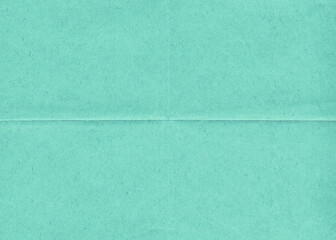 Fototapeta premium Vintage blank folded green paper. Old wrinkled paper background. Crumpled office paper. 