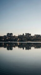 Obraz premium Abandoned Ruins Reflected in Calm Lake Water