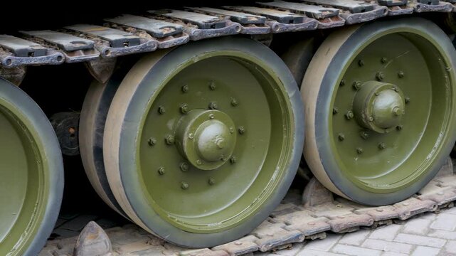 Close up of tank road wheels and tracks