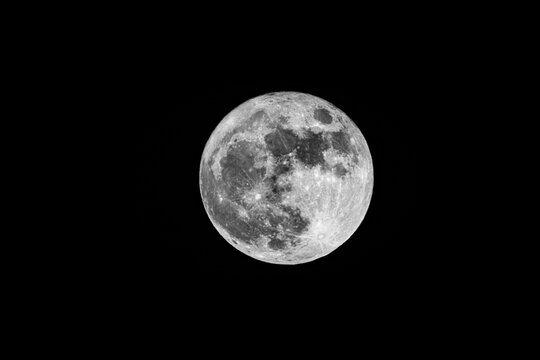 Serene lunar landscape highlighting crater textures and starry background, fullmoon in may