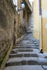 Obraz premium Menton, France - April 10, 2026: Steep stone steps towards Basilique Saint-Michel Archange de Menton in France