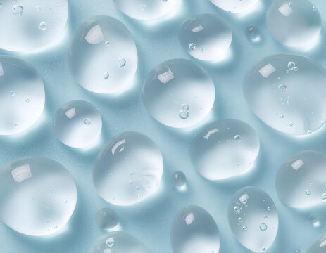 A close-up shot reveals a mesmerizing pattern of translucent spheres suspended in a light blue liquid, creating an abstract and fluid composition.