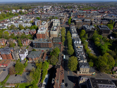 Panoramic view of Tunbridge Wells town center. Aerial view of the town and the streets with green trees. Peaceful sunny day in springtime in Kent, UK.