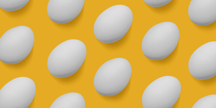 Natural white chicken eggs with soft shadow as minimal style pattern on yellow background. Top view still life banner, creative food layout, egg day holiday concept, graphic flat lay pastel colored.