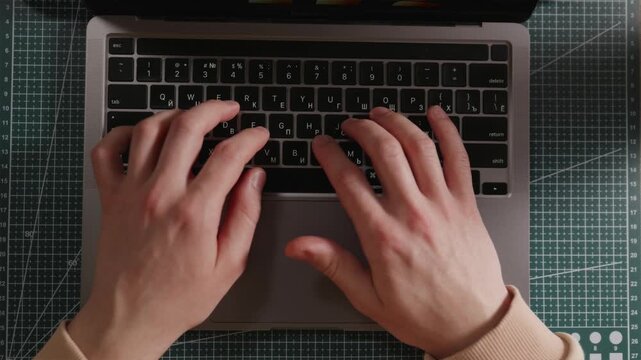 Hands typing on mechanical keyboard for video editing or coding