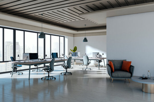 Modern open office interior with spacious desks, ergonomic chairs, computers, large windows, lounge area and contemporary business workspace design. 3D Rendering