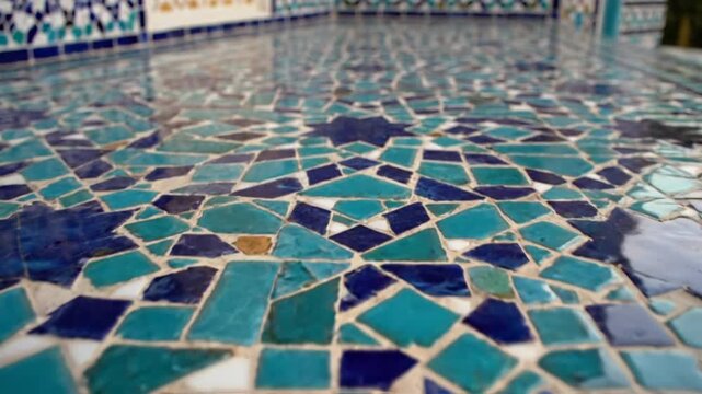 Intricate blue and turquoise geometric mosaic tile pattern close up
