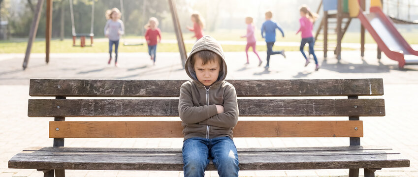 child playground isolation emotional distress behavior challenge school stress closeup with student alone on empty bench and crossed arms suggesting loneliness exclusion and need for emotional support