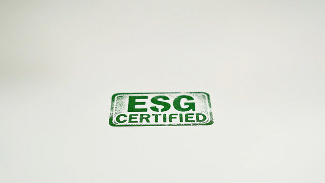 Green ESG certified stamp imprint on white paper background