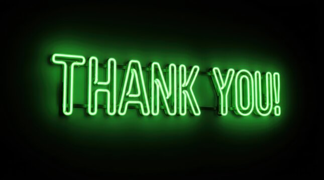Green neon sign with the words thank you glowing against a dark black background for business appreciation.