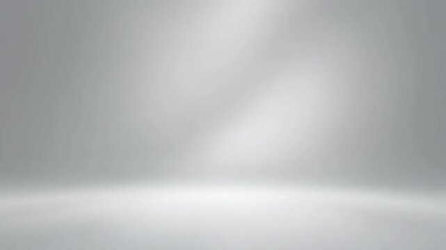 Abstract smooth grey background with soft white light reflections, creating a clean and elegant studio backdrop perfect for product display, branding, or graphic design projects