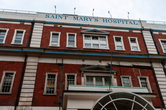 The grand red-brick facade of St. Mary's Hospital in Paddington, London, a world-renowned NHS teaching hospital and site of historic medical breakthroughs like the discovery of penicillin.
