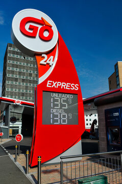 Price totem sign at a Go 24 Express unmanned self-service petrol station displaying unleaded and diesel fuel rates in Belfast