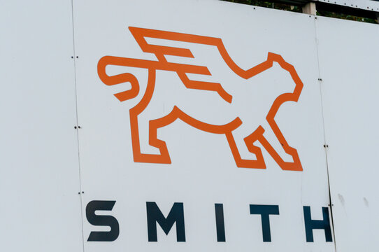 Sign featuring the logo and corporate name at the entrance of a Smith Electric Vehicles manufacturing site