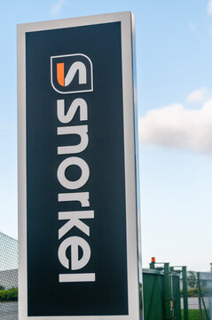 Industrial vertical signage outside the Snorkel Lifts manufacturing facility
