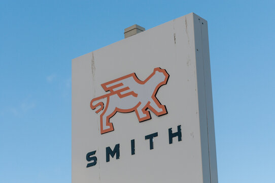 Sign displaying the logo and name outside a Smith Electric Vehicles commercial truck manufacturing facility