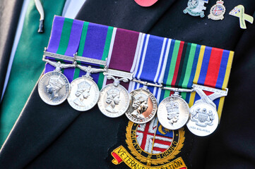 Fototapeta premium British military veteran wears six service medals, showcasing a proud and dignified representatopm of a lifetime of dedication and distinguished armed forces service